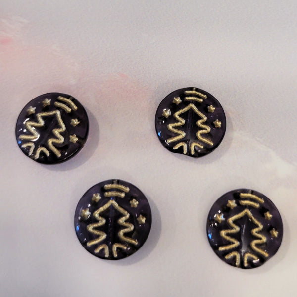 Four smoky purple Czech glass disc beads with metallic gold Christmas tree designs.