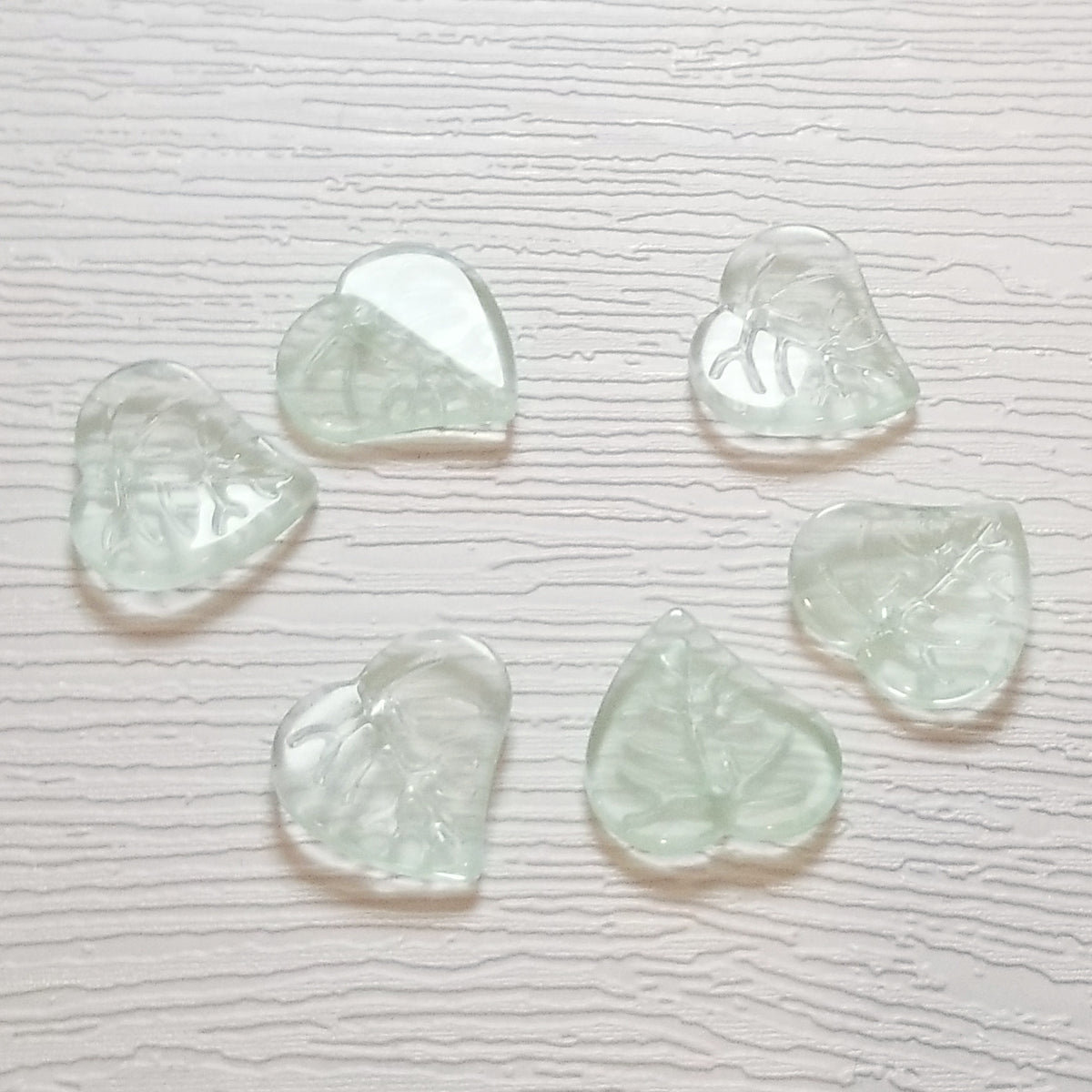 Six seafoam green premium glass leaf heart beads