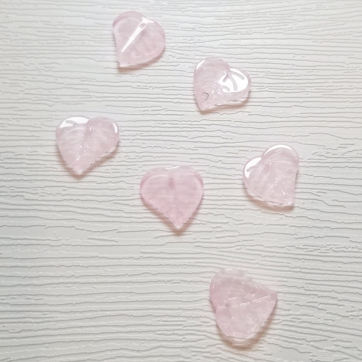 Six pale blush pink premium glass leaf heart beads