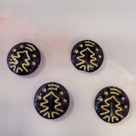 Four smoky purple Czech glass disc beads with metallic gold Christmas tree designs.