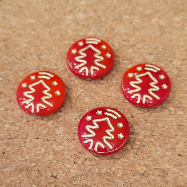 Four opaque red Czech glass disc beads with metallic gold Christmas tree designs.