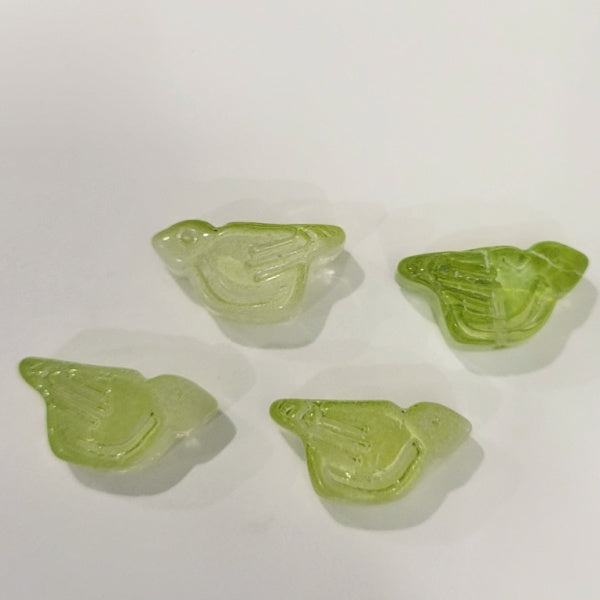 Four spring green pressed glass bird beads