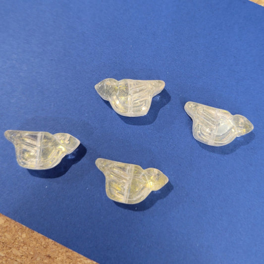 Four crystal clear pressed glass bird beads with a light gold wash