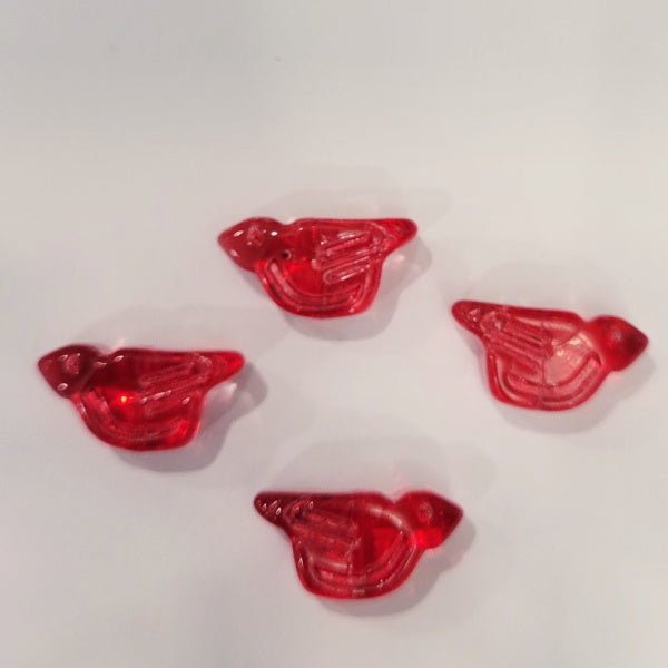 Four transparent red pressed glass bird beads