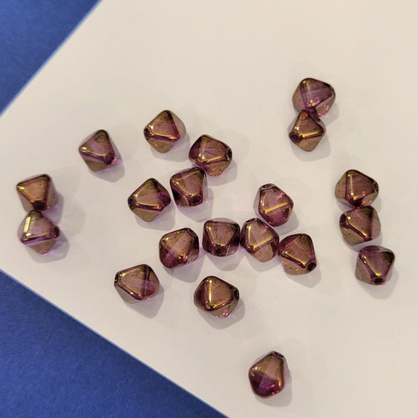 Transparent violet 6mm Czech glass bicone beads with warm gold luster