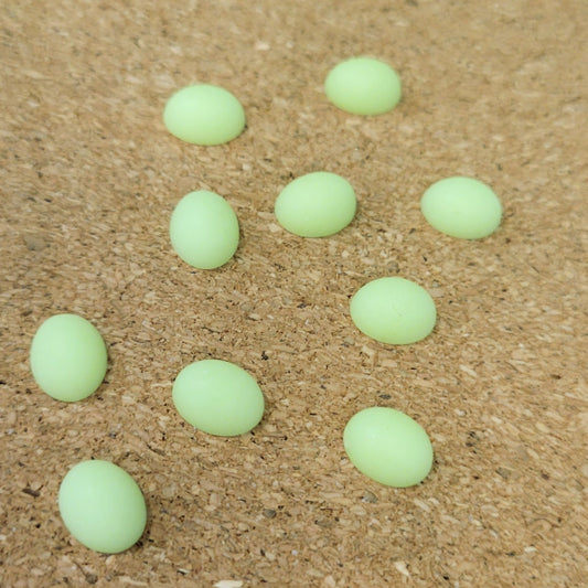Ten matte lime green vintage Lucite oval flatback cabochons.