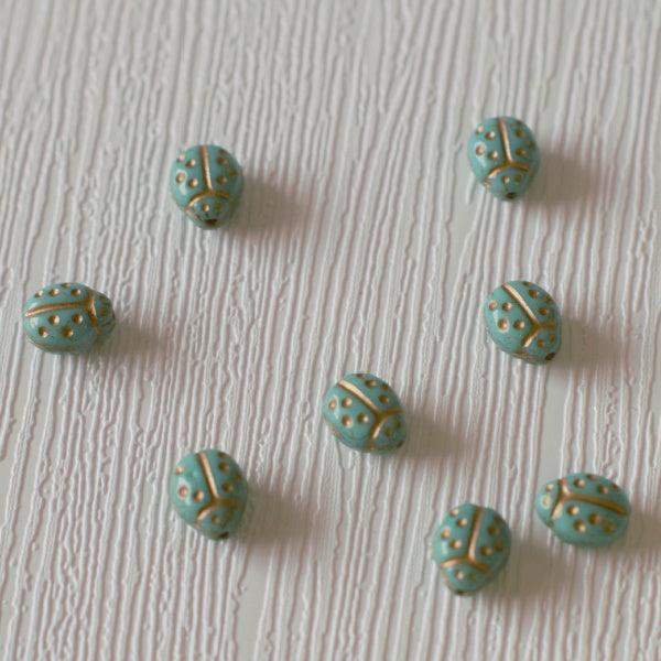 Ladybug Czech Pressed Glass Beads - Sm Aqua w/Gold - Humpday Beads